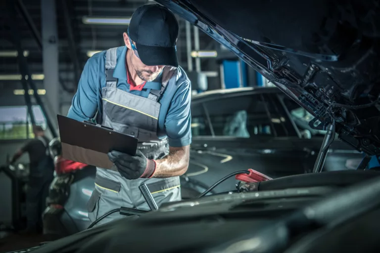 Ken's automotive and transmissions mechanic performing maintenance