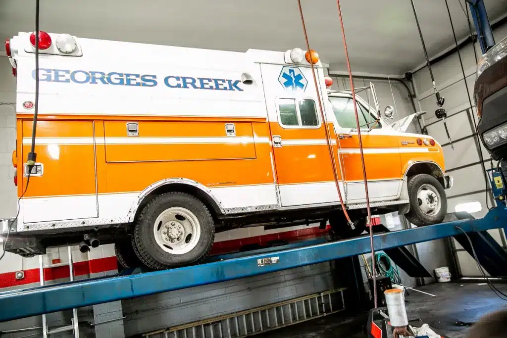 Ken's automotive and transmissions ambulance on lift