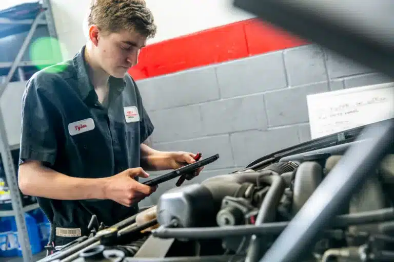 Ken's automotive and transmissions mechanic performs diagnostics