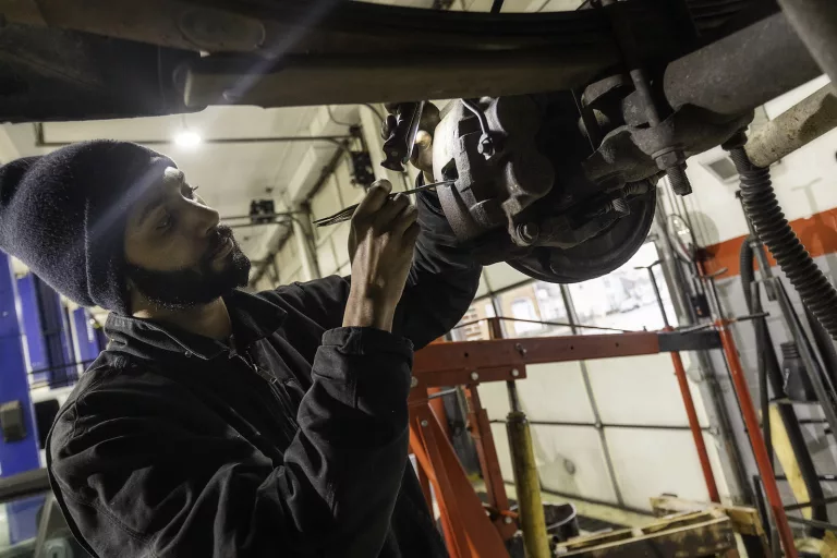 Ken's automotive and transmissions mechanic repairing brakes rotor