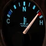 temperature gauge in car dashboard in illuminated night mode - hot