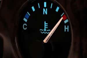 Home 8 temperature gauge in car dashboard in illuminated night mode - hot