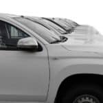 white SUV cars standing in a row. Fleet of generic modern cars. Transportation. Luxury OFFROAD car fleet consisting of generic brandless design. isolated in WHITE background.