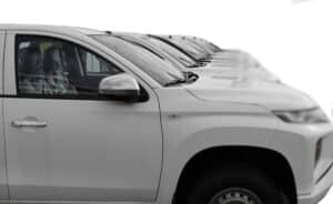 Home 7 white SUV cars standing in a row. Fleet of generic modern cars. Transportation. Luxury OFFROAD car fleet consisting of generic brandless design. isolated in WHITE background.