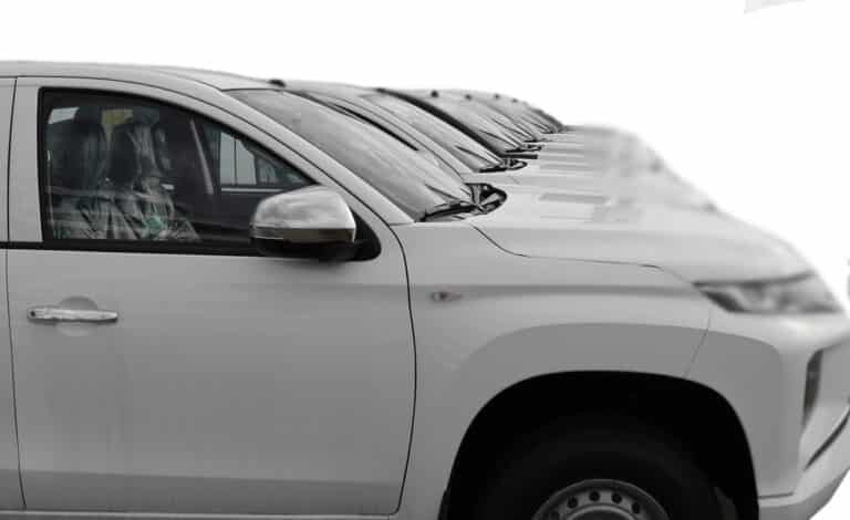 white SUV cars standing in a row. Fleet of generic modern cars. Transportation. Luxury OFFROAD car fleet consisting of generic brandless design. isolated in WHITE background.
