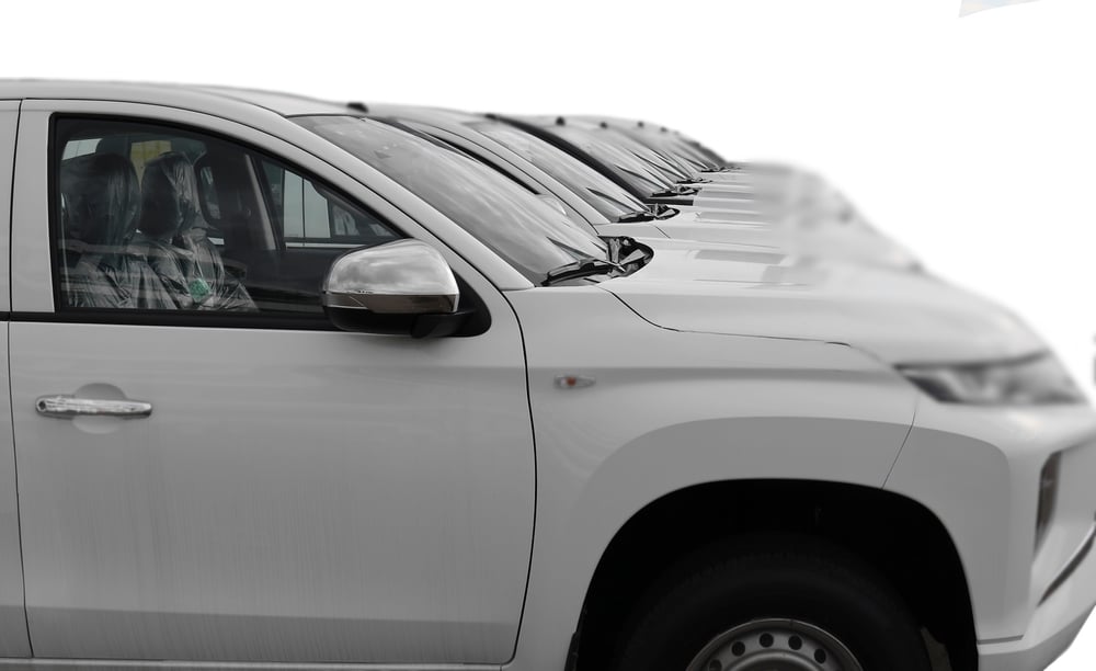 Fleet Vehicle Inspections: What to Include in Your Routine Checklist 1 white SUV cars standing in a row. Fleet of generic modern cars. Transportation. Luxury OFFROAD car fleet consisting of generic brandless design. isolated in WHITE background.