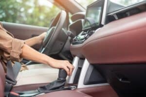 Home 7 woman driver stick shift transmission a car gear, hand controlling steering wheel during vehicle moving. Journey, trip and safety Transportation concepts